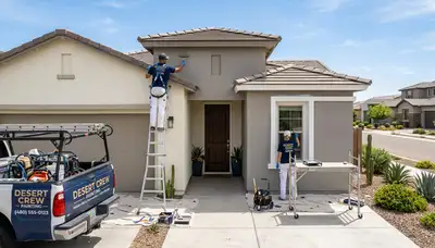 Professional house painters working on a Scottsdale AZ home exterior repaint project